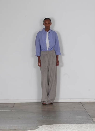 Model wearing the ultrasuede wide leg pullon pant grey walking forward and turning around