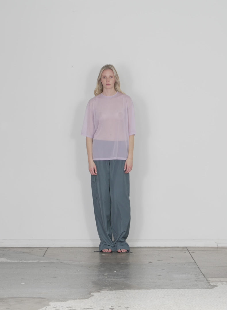 Model wearing the sheer gauze easy t dusty lavender walking forward and turning around
